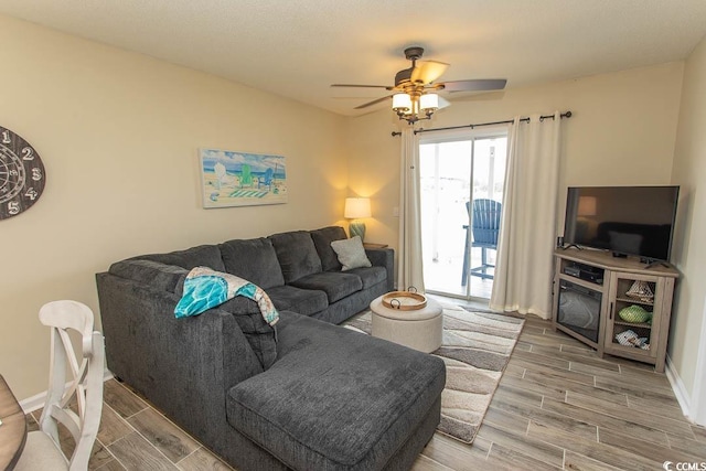 201 Landing Rd Unit D, North Myrtle Beach, SC 29582 - living area featuring wood tiled floor, ceiling fan, and baseboards