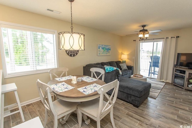 201 Landing Rd Unit D, North Myrtle Beach, SC 29582 - dining room with baseboards, visible vents, a ceiling fan, and wood finish floors