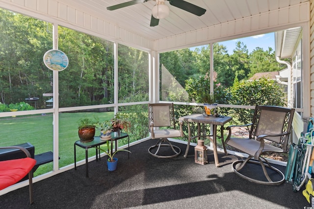 sunroom / solarium featuring ceiling fan