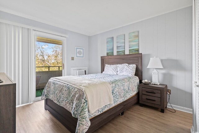 9501 Shore Dr Unit B-316, Myrtle Beach, SC 29572 - bedroom with baseboards, wood finished floors, and access to exterior
