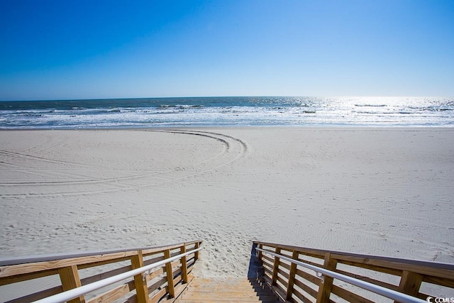 property view of water featuring a beach view