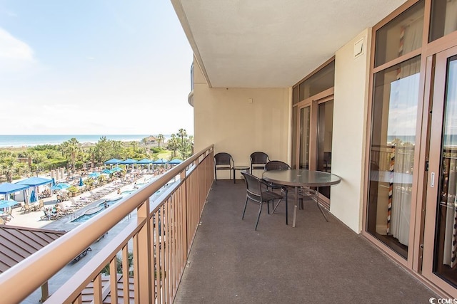balcony featuring a water view