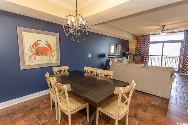 dining area featuring crown molding, baseboards, stone finish floor, and ceiling fan with notable chandelier