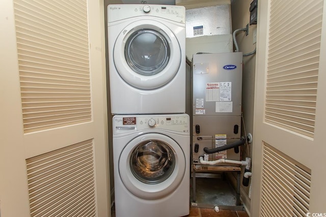 washroom with laundry area and stacked washer / dryer