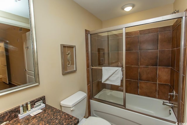 full bath with shower / bath combination with glass door and toilet