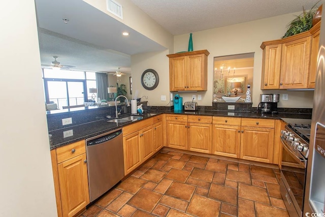 100 N Beach Blvd Unit 1801, North Myrtle Beach, SC 29582 - kitchen with stone finish floor, a ceiling fan, visible vents, appliances with stainless steel finishes, and a sink