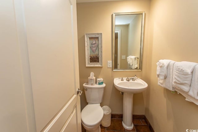 100 N Beach Blvd Unit 1801, North Myrtle Beach, SC 29582 - half bathroom featuring toilet, baseboards, a sink, and tile patterned flooring
