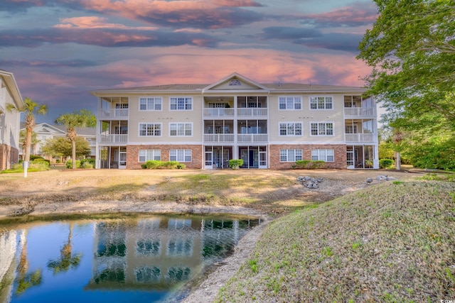 view of building exterior with a water view