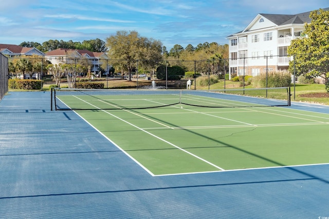 view of sport court featuring fence and community basketball court