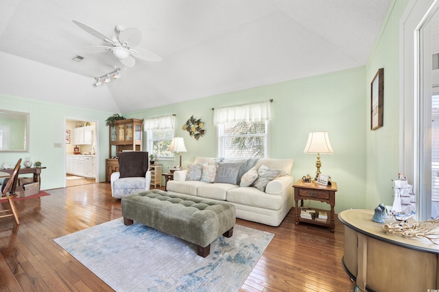 820 9th Ave S, North Myrtle Beach, SC 29582 - living room featuring vaulted ceiling, wood-type flooring, ceiling fan, and rail lighting