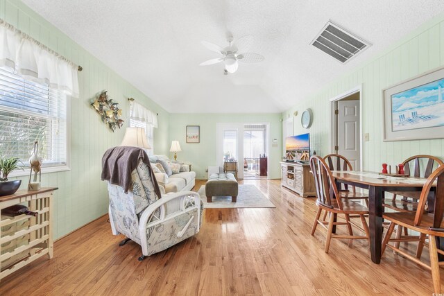 820 9th Ave S, North Myrtle Beach, SC 29582 - living room featuring a ceiling fan, light wood-style floors, and lofted ceiling