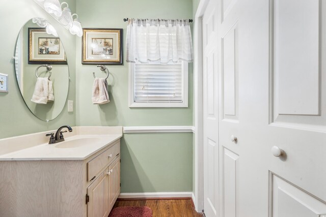 820 9th Ave S, North Myrtle Beach, SC 29582 - bathroom featuring vanity, wood finished floors, baseboards, and a closet