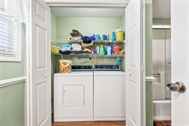 820 9th Ave S, North Myrtle Beach, SC 29582 - washroom featuring washer and clothes dryer and a textured ceiling