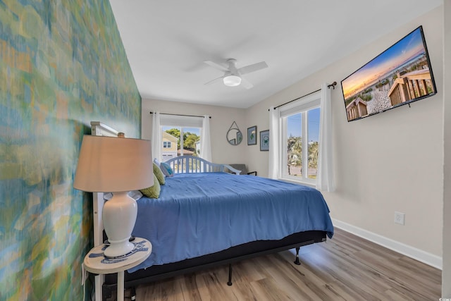 800 9th Ave S Unit A-4, North Myrtle Beach, SC 29582 - bedroom featuring baseboards, ceiling fan, and wood finished floors