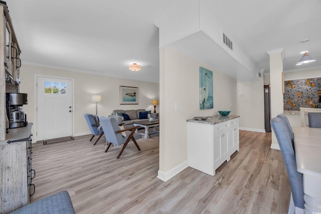 800 9th Ave S Unit A-4, North Myrtle Beach, SC 29582 - interior space featuring crown molding, baseboards, visible vents, and light wood finished floors