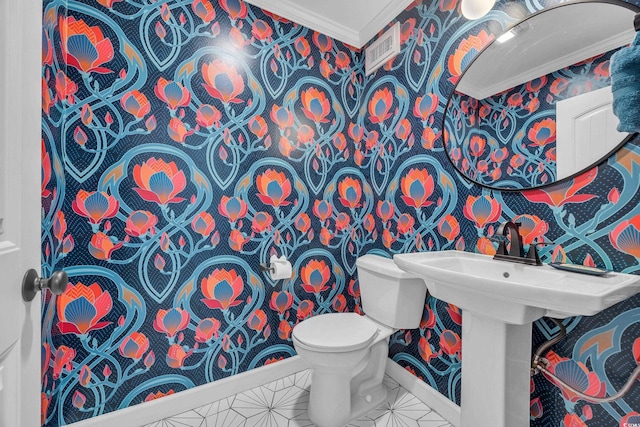 800 9th Ave S Unit A-4, North Myrtle Beach, SC 29582 - half bath featuring visible vents, ornamental molding, toilet, baseboards, and wallpapered walls