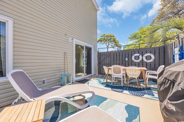 800 9th Ave S Unit A-4, North Myrtle Beach, SC 29582 - view of patio / terrace with fence and outdoor dining area