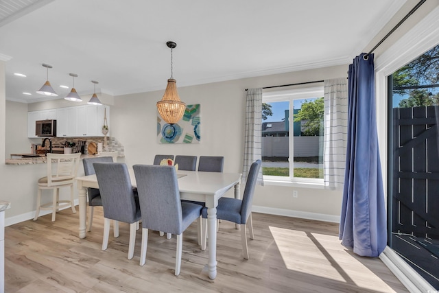 800 9th Ave S Unit A-4, North Myrtle Beach, SC 29582 - dining space with baseboards, plenty of natural light, light wood-style flooring, recessed lighting, and ornamental molding