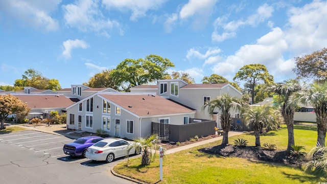 800 9th Ave S Unit A-4, North Myrtle Beach, SC 29582 - exterior space with fence, uncovered parking, and a front yard