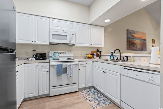 102 Scotch Broom Dr Unit B-302, Little River, SC 29566 - kitchen featuring recessed lighting, white appliances, light countertops, white cabinets, and a sink