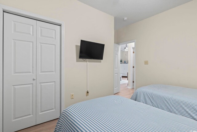 102 Scotch Broom Dr Unit B-302, Little River, SC 29566 - bedroom featuring light wood-type flooring and a closet