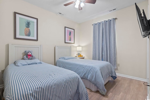 102 Scotch Broom Dr Unit B-302, Little River, SC 29566 - bedroom with baseboards, visible vents, wood finished floors, and ceiling fan