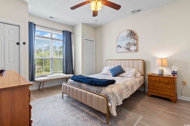 102 Scotch Broom Dr Unit B-302, Little River, SC 29566 - bedroom with wood finished floors, visible vents, a ceiling fan, and baseboards