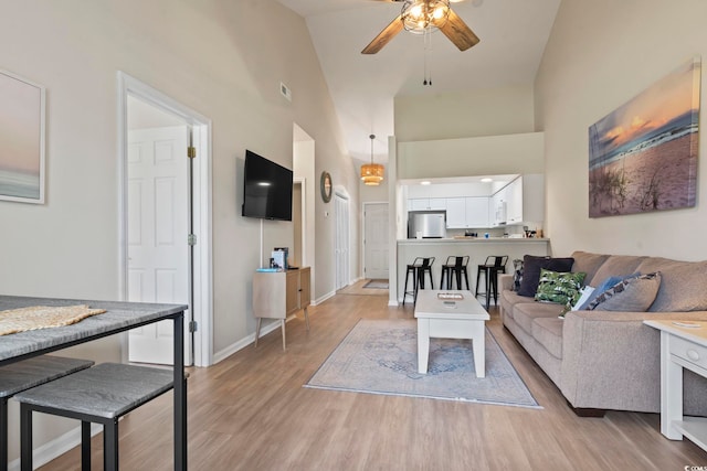 102 Scotch Broom Dr Unit B-302, Little River, SC 29566 - living area with a ceiling fan, high vaulted ceiling, baseboards, and light wood-type flooring