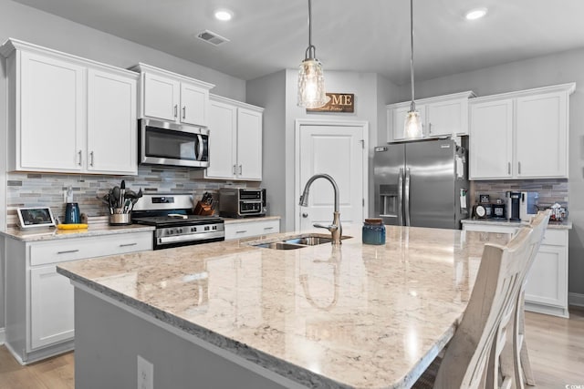 239 Calhoun Falls Dr, Myrtle Beach, SC 29579 - kitchen featuring stainless steel appliances, a sink, white cabinetry, and recessed lighting