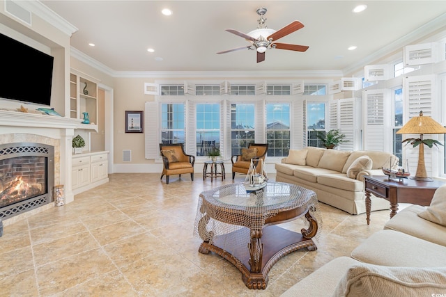living area with crown molding, ceiling fan, a fireplace, built in features, and recessed lighting
