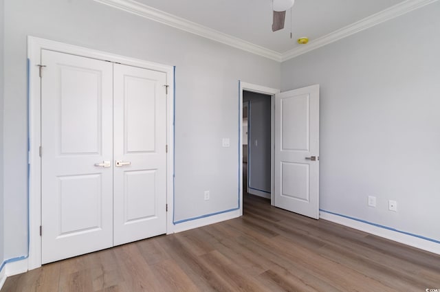 1500 Sunmeadow Dr, Conway, SC 29526 - unfurnished bedroom featuring wood finished floors, crown molding, baseboards, a closet, and a ceiling fan