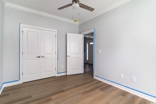1500 Sunmeadow Dr, Conway, SC 29526 - unfurnished bedroom with light wood finished floors, crown molding, a closet, baseboards, and a ceiling fan