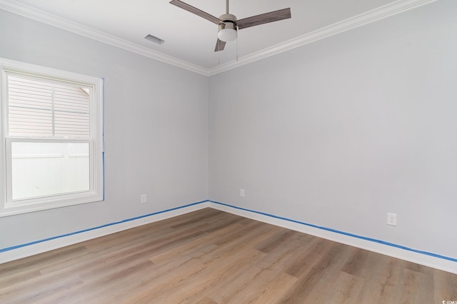 1500 Sunmeadow Dr, Conway, SC 29526 - empty room with wood finished floors, a ceiling fan, crown molding, and baseboards