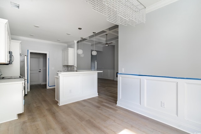 1500 Sunmeadow Dr, Conway, SC 29526 - kitchen featuring a chandelier, coffered ceiling, ornamental molding, white cabinets, and light countertops
