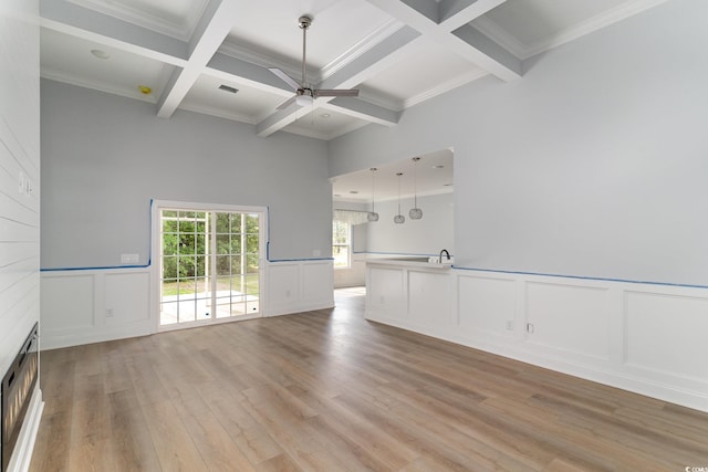 1500 Sunmeadow Dr, Conway, SC 29526 - unfurnished living room with beamed ceiling, a ceiling fan, coffered ceiling, a decorative wall, and light wood-style floors