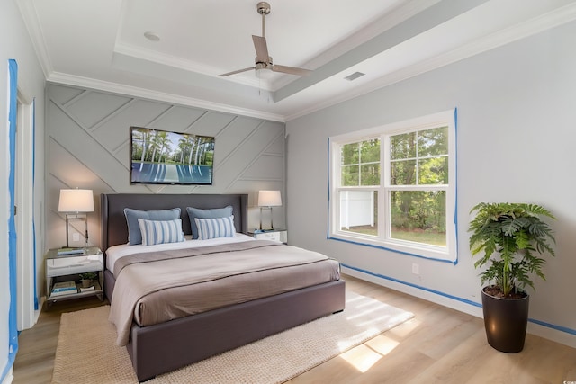 1500 Sunmeadow Dr, Conway, SC 29526 - bedroom with ornamental molding, light wood-type flooring, a raised ceiling, baseboards, and a ceiling fan