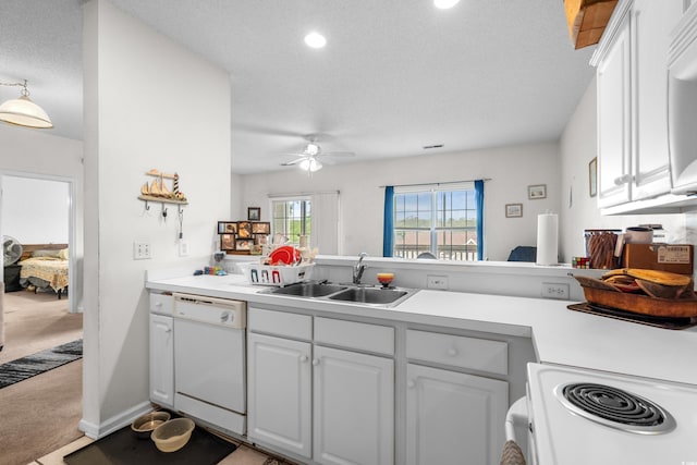 1058 Sea Mountain Hwy Unit 5-301, North Myrtle Beach, SC 29582 - kitchen with a ceiling fan, a sink, white appliances, light countertops, and light colored carpet
