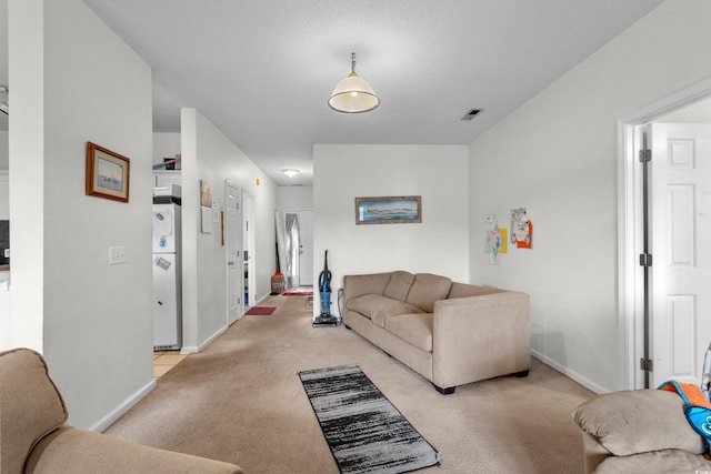 1058 Sea Mountain Hwy Unit 5-301, North Myrtle Beach, SC 29582 - living area featuring baseboards, visible vents, and light colored carpet