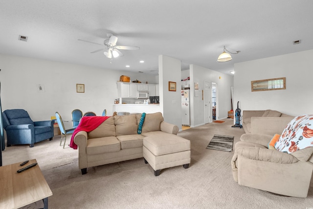 1058 Sea Mountain Hwy Unit 5-301, North Myrtle Beach, SC 29582 - living room with visible vents, a ceiling fan, and light carpet