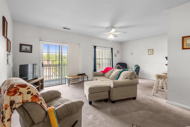 1058 Sea Mountain Hwy Unit 5-301, North Myrtle Beach, SC 29582 - living room featuring a ceiling fan, visible vents, carpet floors, and a textured ceiling