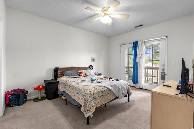 1058 Sea Mountain Hwy Unit 5-301, North Myrtle Beach, SC 29582 - bedroom with a textured ceiling, carpet floors, visible vents, and access to exterior