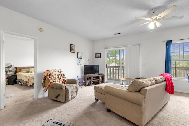 1058 Sea Mountain Hwy Unit 5-301, North Myrtle Beach, SC 29582 - living room featuring a ceiling fan, visible vents, a wealth of natural light, and light colored carpet