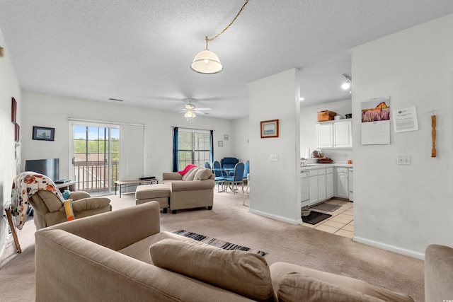 1058 Sea Mountain Hwy Unit 5-301, North Myrtle Beach, SC 29582 - living room with a ceiling fan, baseboards, a textured ceiling, and light colored carpet