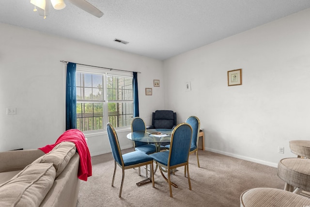 1058 Sea Mountain Hwy Unit 5-301, North Myrtle Beach, SC 29582 - carpeted dining area featuring baseboards, visible vents, a textured ceiling, and ceiling fan