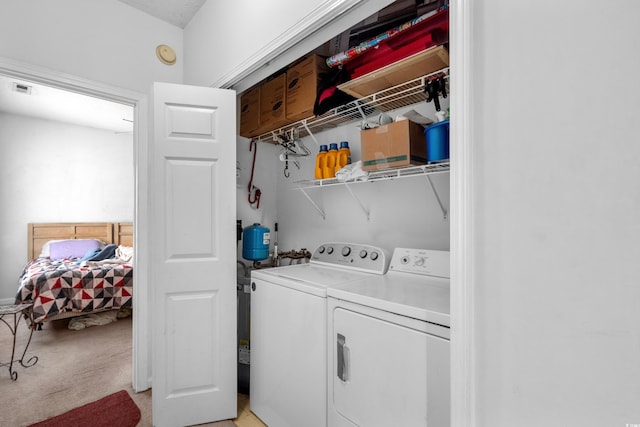 1058 Sea Mountain Hwy Unit 5-301, North Myrtle Beach, SC 29582 - washroom featuring washing machine and dryer, visible vents, laundry area, and light colored carpet