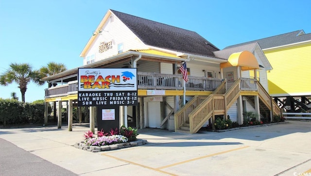 336 Bayou Loop Lot 71, Surfside Beach, SC 29575 - view of building exterior featuring concrete driveway, stairs, and a carport