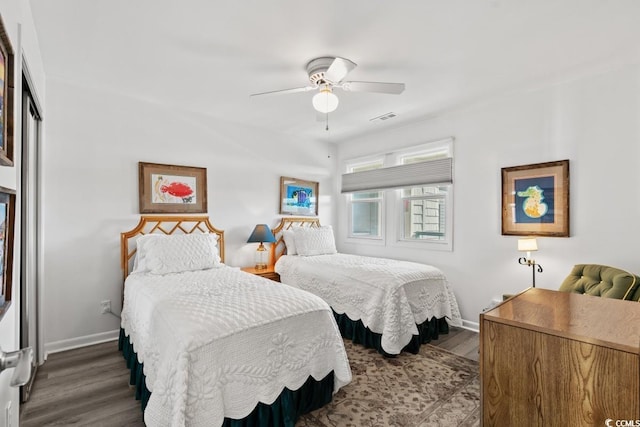 201 N Hillside Dr N Unit 307, North Myrtle Beach, SC 29582 - bedroom with baseboards, wood finished floors, visible vents, and ceiling fan