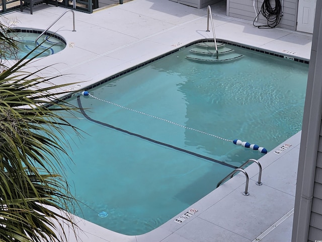 201 N Hillside Dr N Unit 307, North Myrtle Beach, SC 29582 - community pool featuring a community hot tub