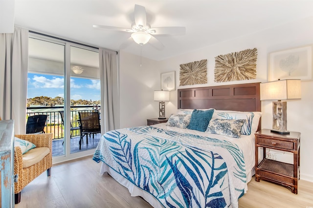 bedroom with ceiling fan, access to exterior, and light wood-style floors