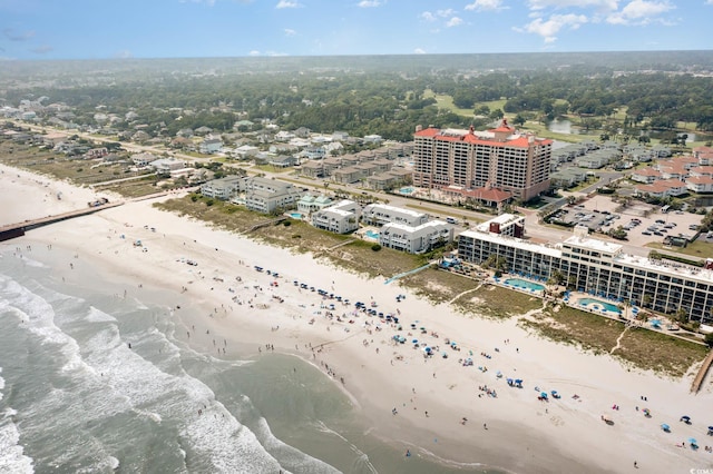 birds eye view of property featuring a water view and a view of the beach